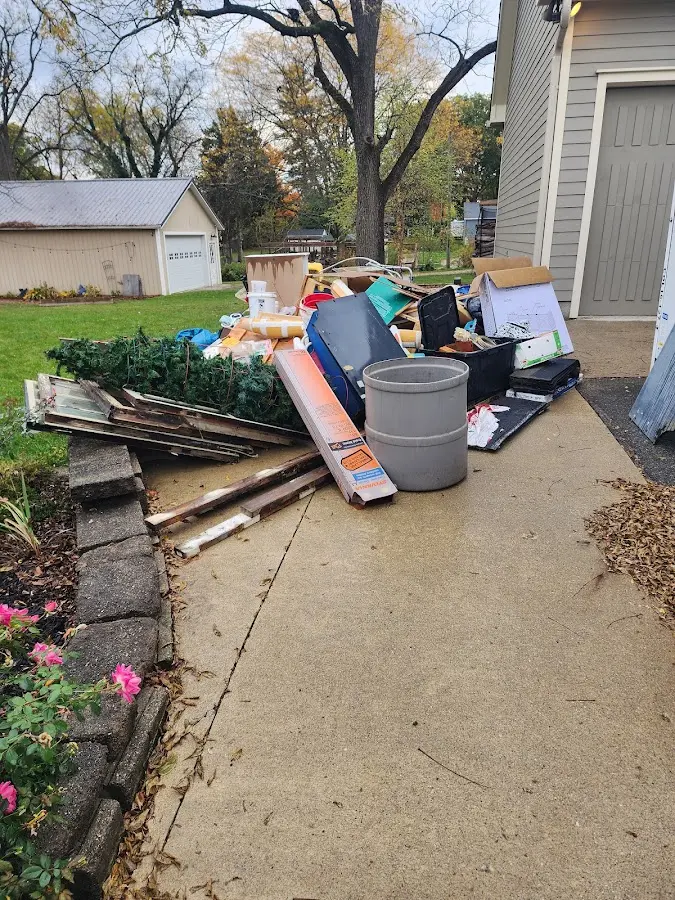 Dumpster being loaded with debris for 30 Yard Dumpster Rental in Weirton